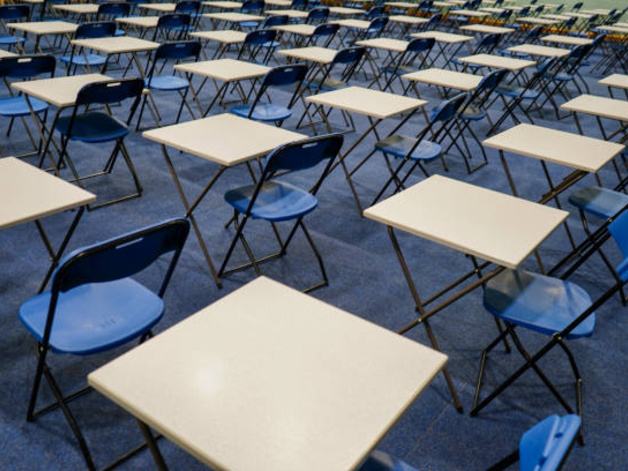 empty desks in an examination room