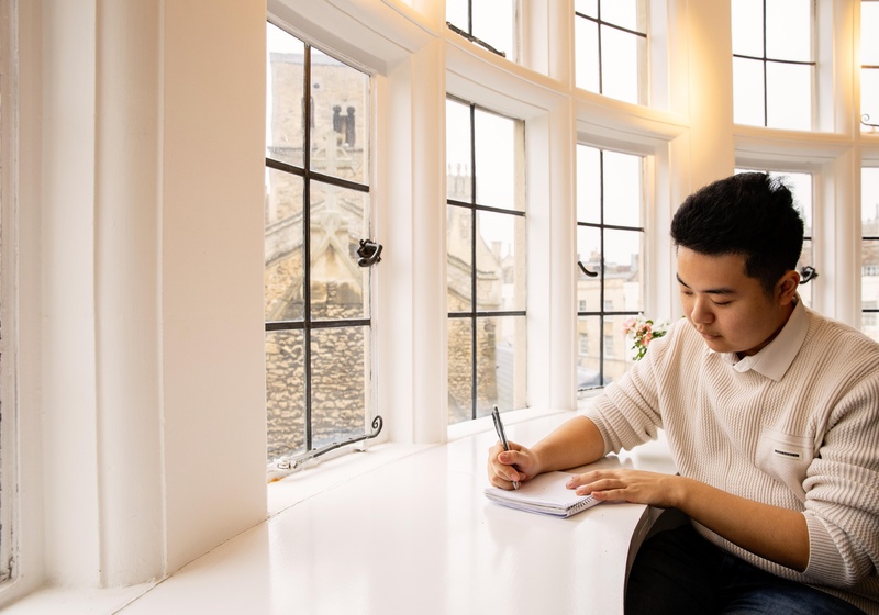 student working by window