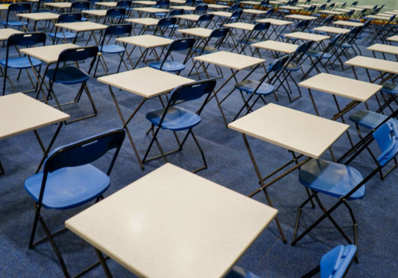 empty desks in an examination room